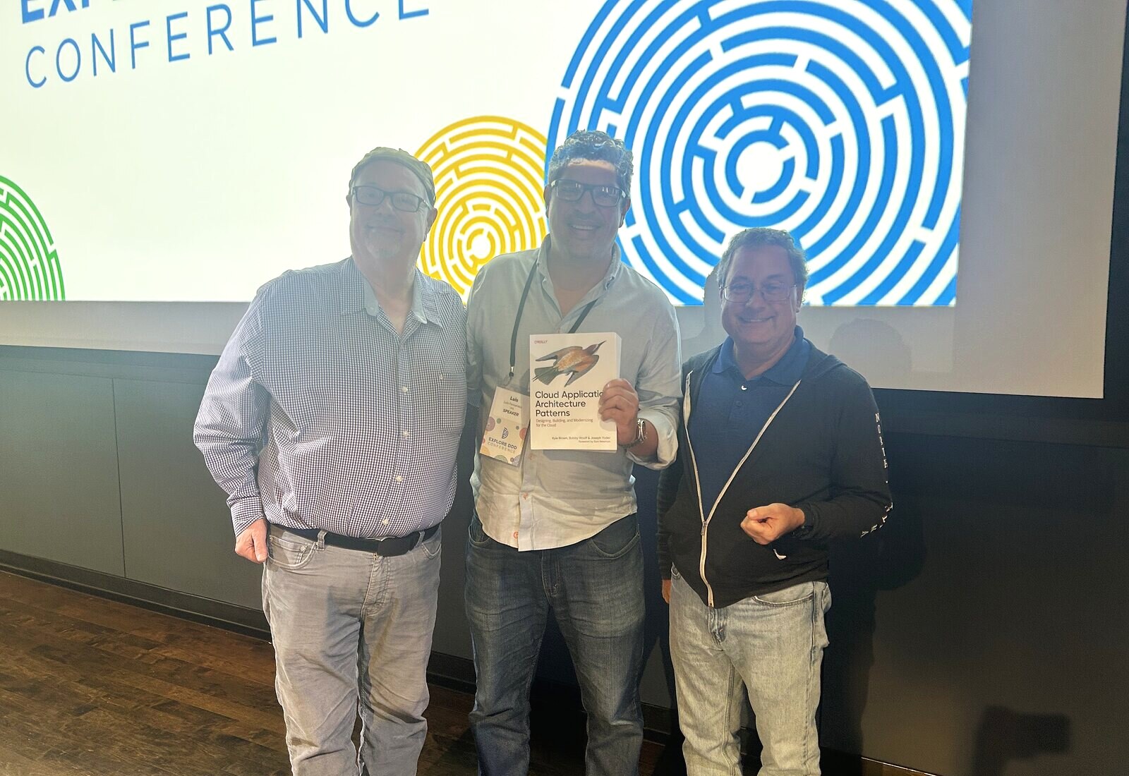 With Joseph Yoder and Kyle Brown, holding their book Cloud Application Architecture Patterns